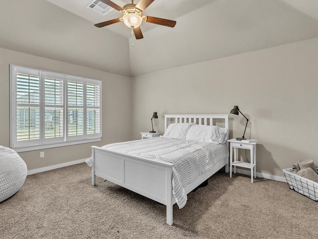 carpeted bedroom with vaulted ceiling and ceiling fan