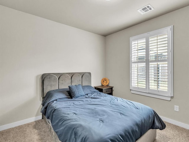 bedroom with light carpet