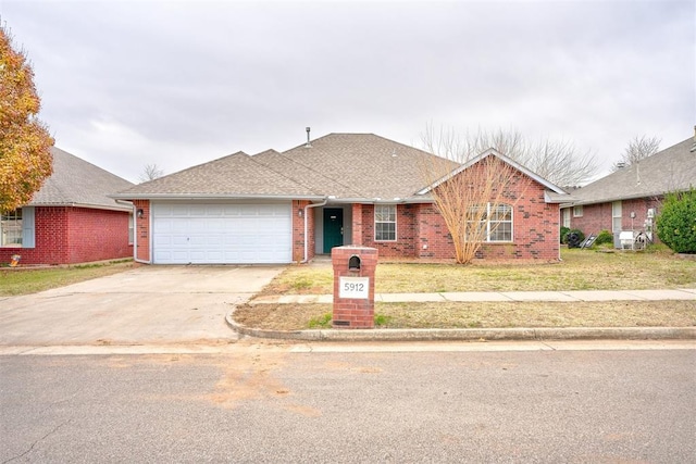 single story home featuring a front lawn and a garage