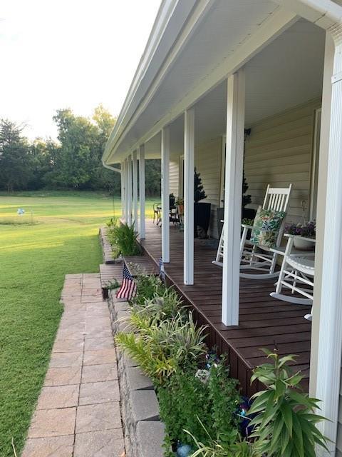 deck featuring a lawn