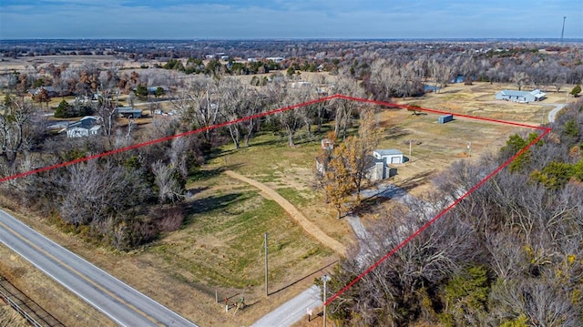 birds eye view of property with a rural view