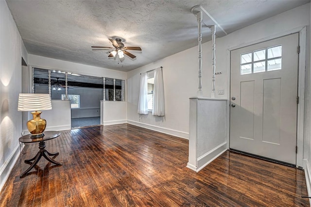 entryway with ceiling fan, hardwood / wood-style floors, and a textured ceiling