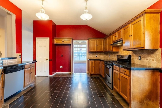 kitchen featuring pendant lighting, lofted ceiling, backsplash, dark hardwood / wood-style floors, and stainless steel appliances