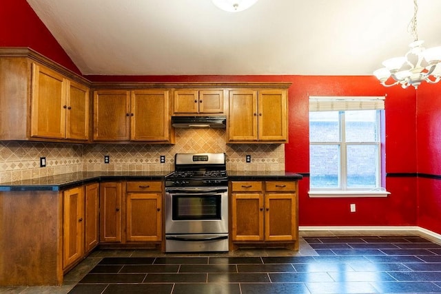 kitchen with decorative backsplash, gas stove, vaulted ceiling, and a chandelier