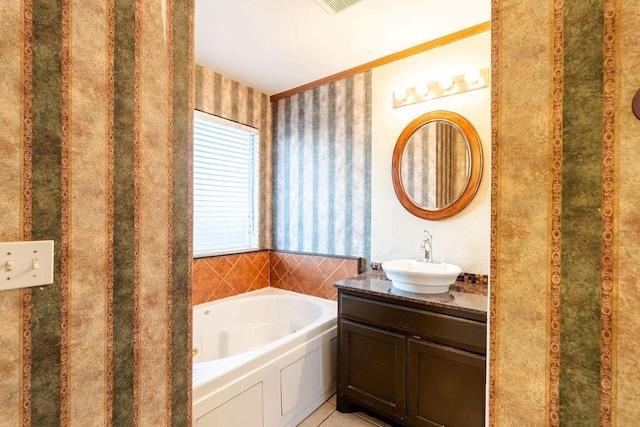 bathroom featuring vanity and a washtub