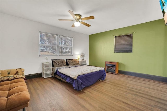 bedroom featuring ceiling fan and wood-type flooring