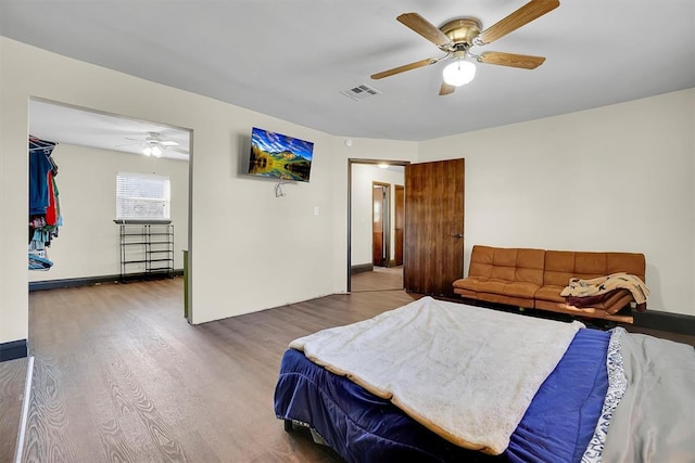 bedroom featuring wood-type flooring and ceiling fan