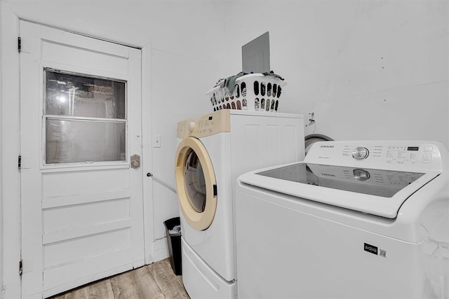 washroom featuring light hardwood / wood-style floors and independent washer and dryer