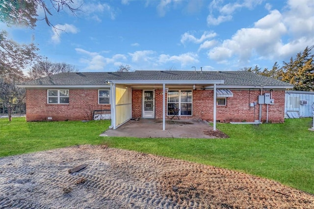 back of property featuring a yard and a patio area