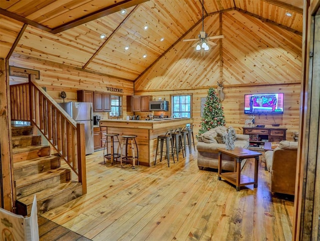 dining area with wood ceiling and light wood-type flooring