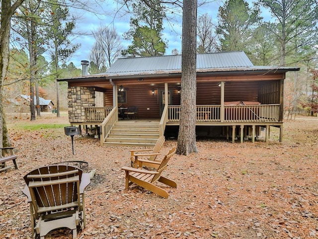 back of property with a porch