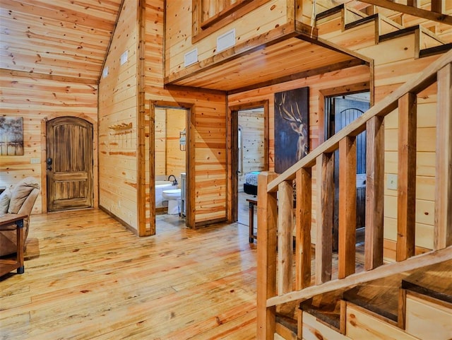 527 High Peak Trl, Broken Bow, OK 74728 - entryway featuring wooden walls, hardwood / wood-style floors, high vaulted ceiling, and wooden ceiling