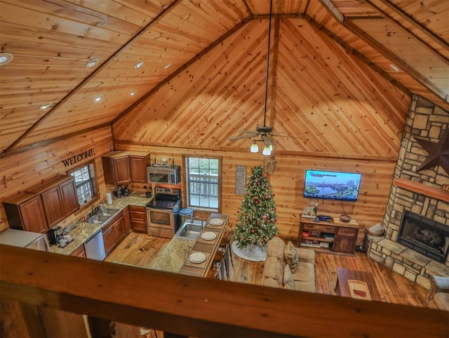 527 High Peak Trl, Broken Bow, OK 74728 - living room featuring wood ceiling, wood walls, light wood finished floors, a fireplace, and high vaulted ceiling
