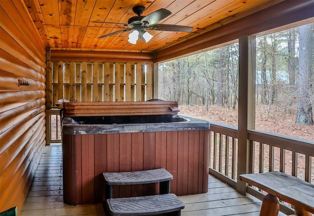 527 High Peak Trl, Broken Bow, OK 74728 - wooden terrace with a hot tub, a ceiling fan, and a view of trees