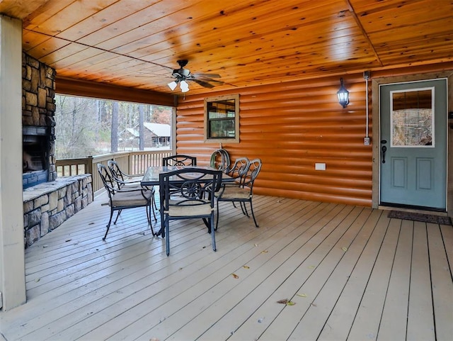 527 High Peak Trl, Broken Bow, OK 74728 - wooden deck with outdoor dining space and a ceiling fan