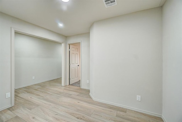 unfurnished room featuring light hardwood / wood-style flooring