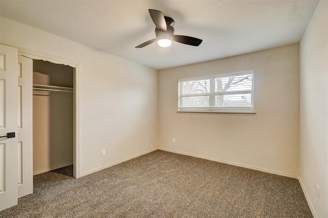 unfurnished bedroom featuring carpet, ceiling fan, and a closet