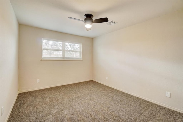 carpeted empty room with ceiling fan