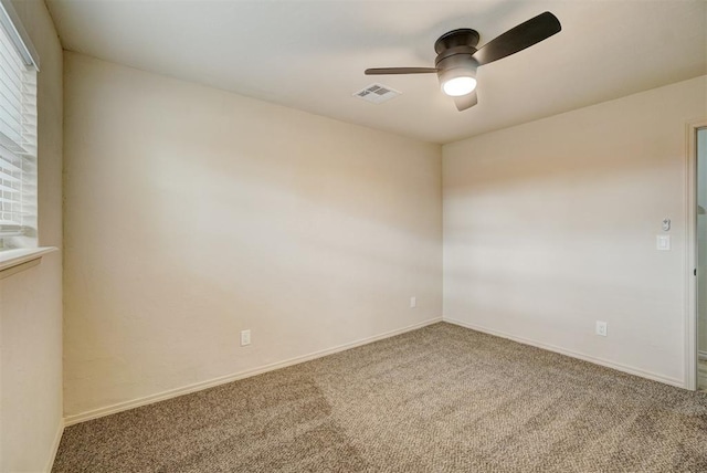 carpeted empty room with ceiling fan