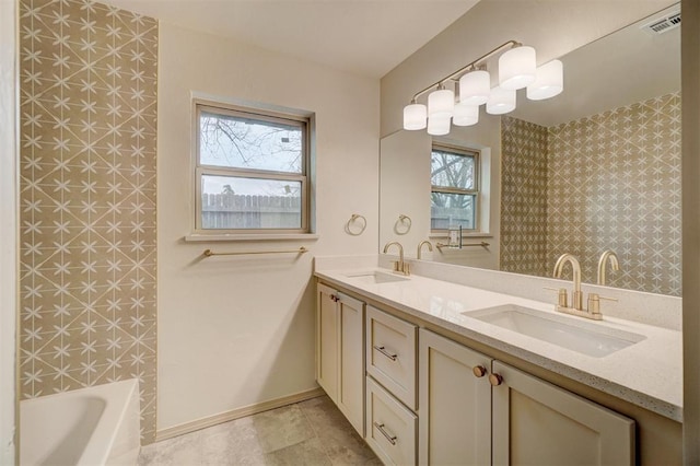 bathroom featuring vanity and a wealth of natural light