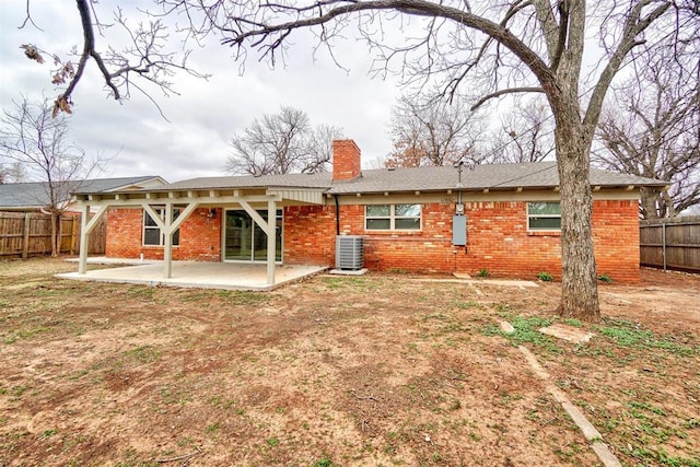 rear view of property with a patio area and central air condition unit