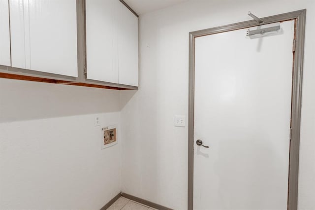 clothes washing area featuring cabinets and hookup for a washing machine
