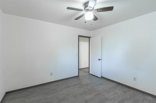 unfurnished room featuring ceiling fan and wood-type flooring