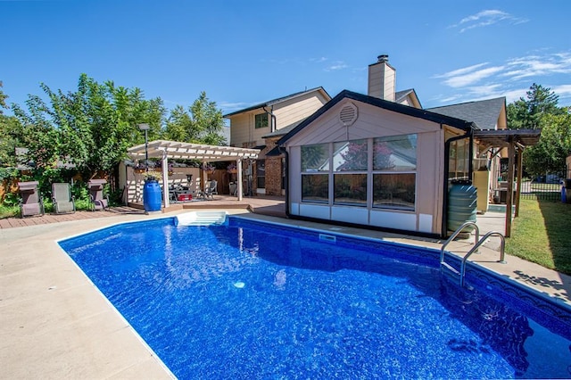 view of swimming pool featuring a pergola and a patio