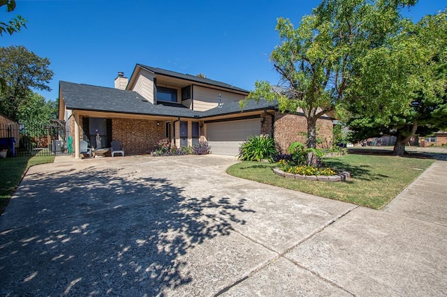 view of front of home featuring a garage and a front yard