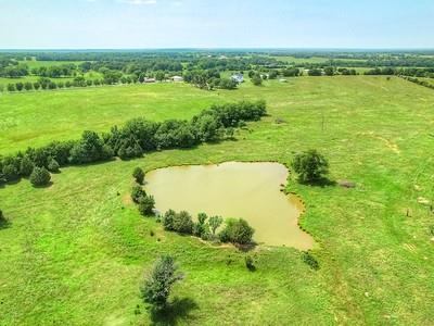 aerial view with a water view and a rural view