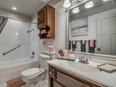 full bathroom featuring toilet, vanity, and shower / tub combo with curtain