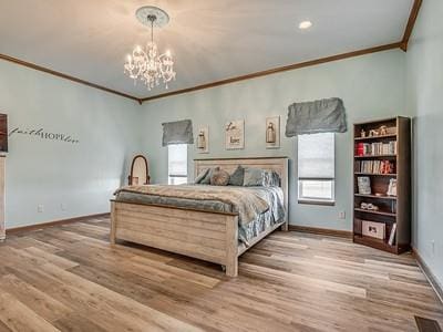 bedroom with wood-type flooring, an inviting chandelier, and ornamental molding