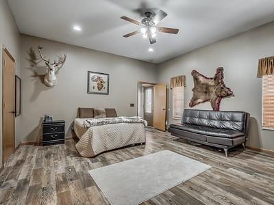 bedroom featuring ceiling fan and wood-type flooring