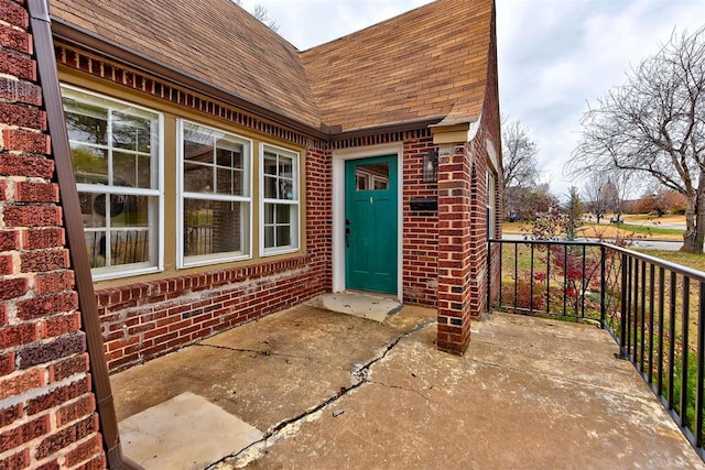 view of exterior entry with a porch