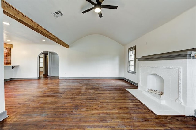 unfurnished living room with lofted ceiling with beams, ceiling fan, and dark wood-type flooring