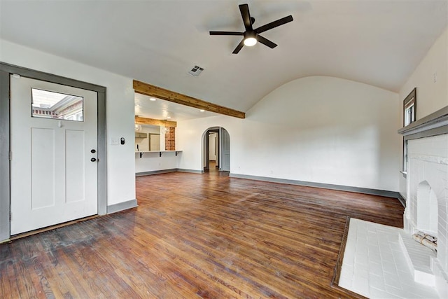 unfurnished living room with dark wood-type flooring, a brick fireplace, ceiling fan, and lofted ceiling