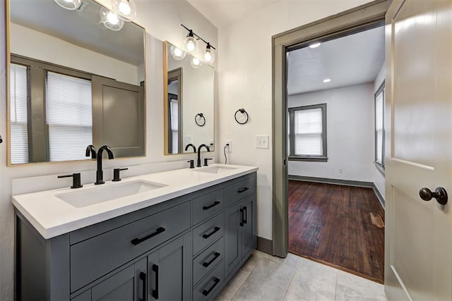 bathroom with vanity and wood-type flooring