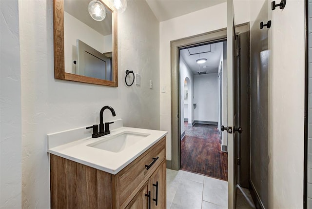 bathroom with hardwood / wood-style floors and vanity