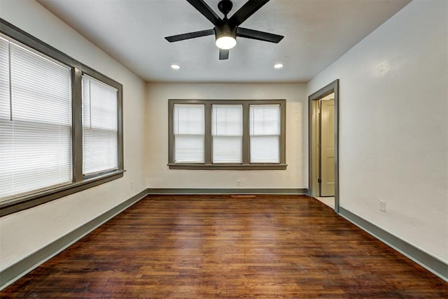 empty room with dark wood-style floors, recessed lighting, ceiling fan, and baseboards