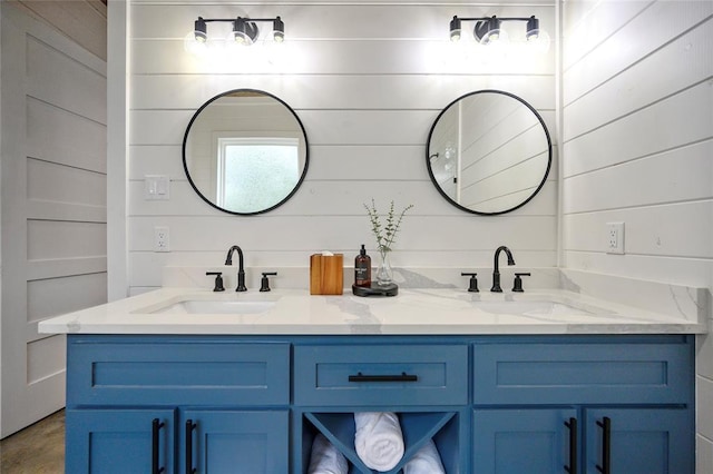 bathroom with wood walls and vanity