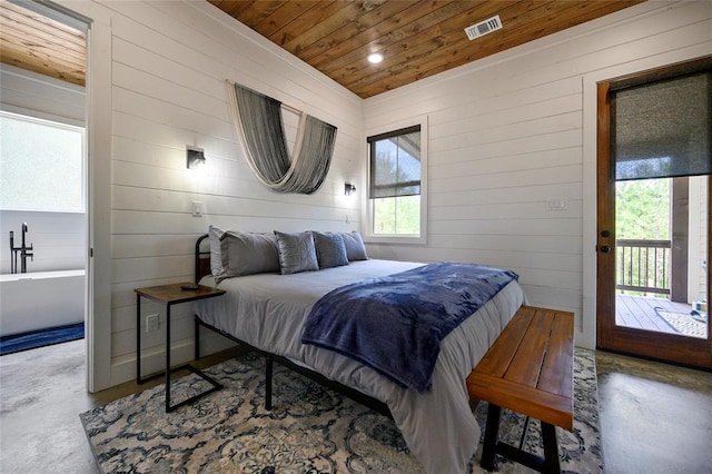 bedroom featuring wood ceiling, multiple windows, access to outside, and concrete floors