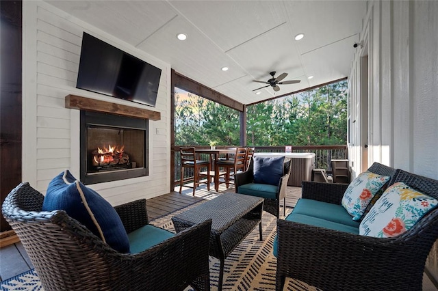 view of patio featuring an outdoor living space with a fireplace and ceiling fan