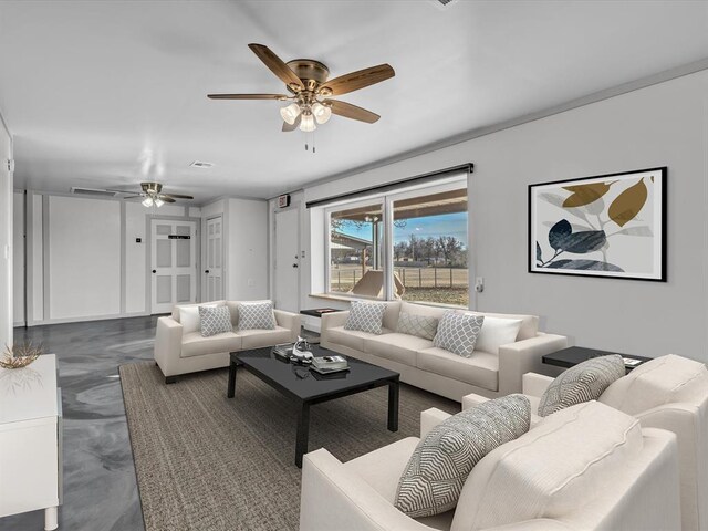 living room featuring ceiling fan and concrete floors