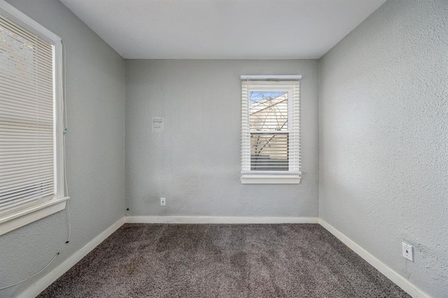 empty room featuring carpet flooring