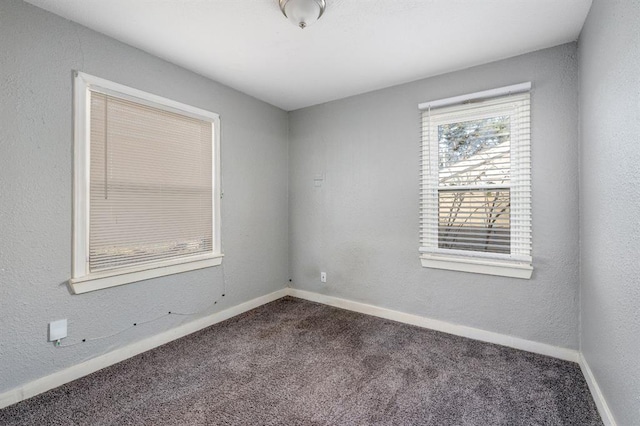 unfurnished room featuring carpet flooring