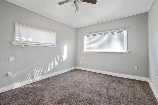 unfurnished room featuring ceiling fan, carpet floors, and a textured ceiling