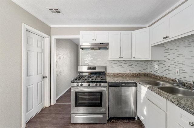 kitchen featuring sink, white cabinets, dark hardwood / wood-style floors, and appliances with stainless steel finishes