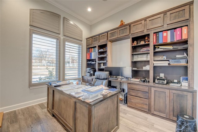 office space with crown molding and light wood-type flooring