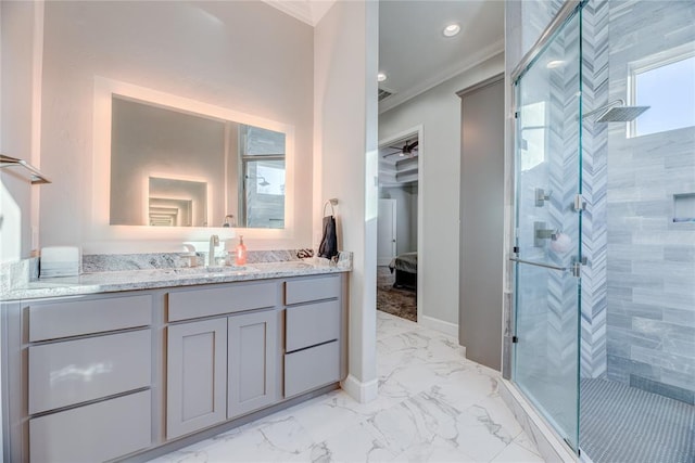 bathroom featuring vanity, an enclosed shower, and crown molding