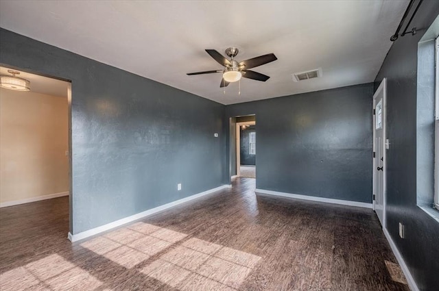 unfurnished room with hardwood / wood-style flooring and ceiling fan